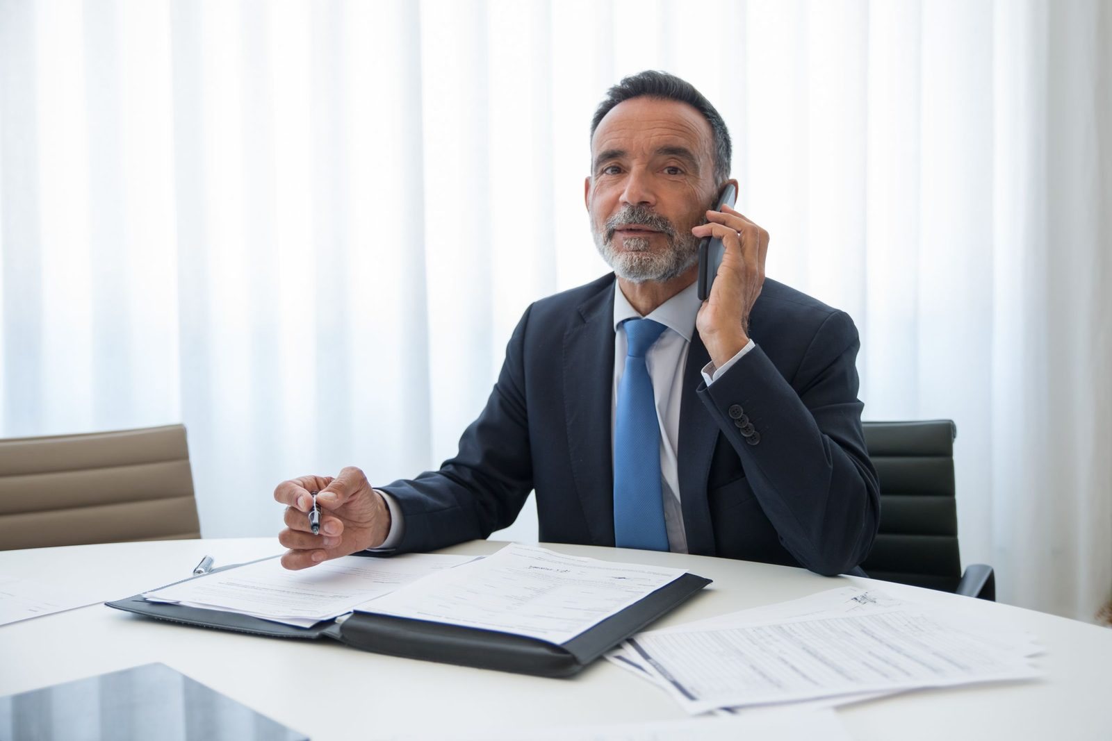 An adviser on the phone at his desk